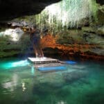 Cave pool with stairs and platform.