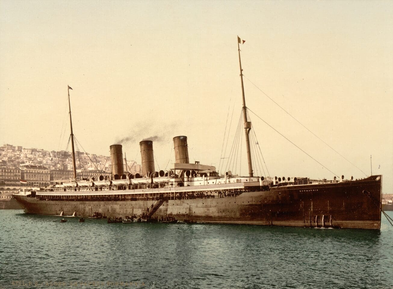 Historic steamship docked at a port.