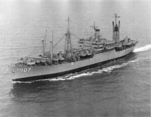 Military ship sailing on the ocean.